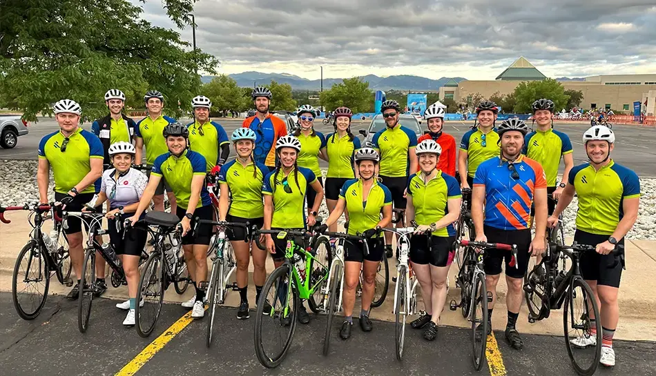 Group photo of people and their bicycles