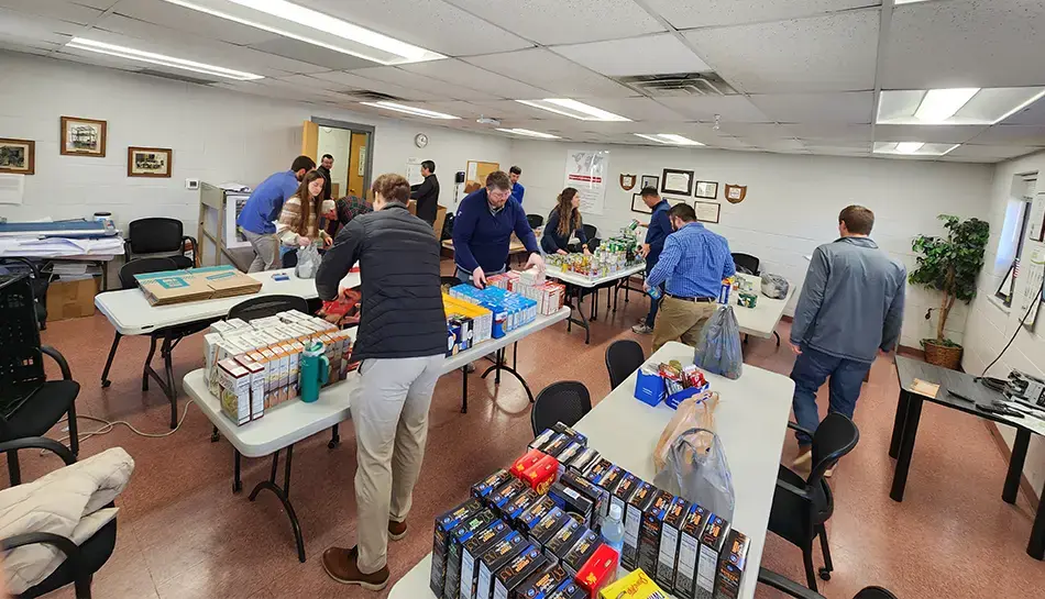 people pack meal kits in office 