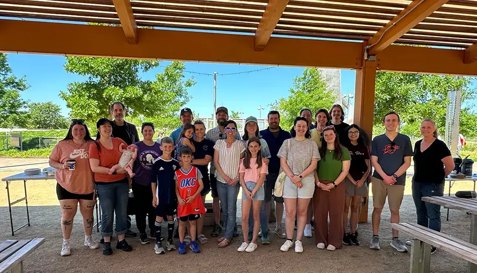 team photo under a picnic shelter