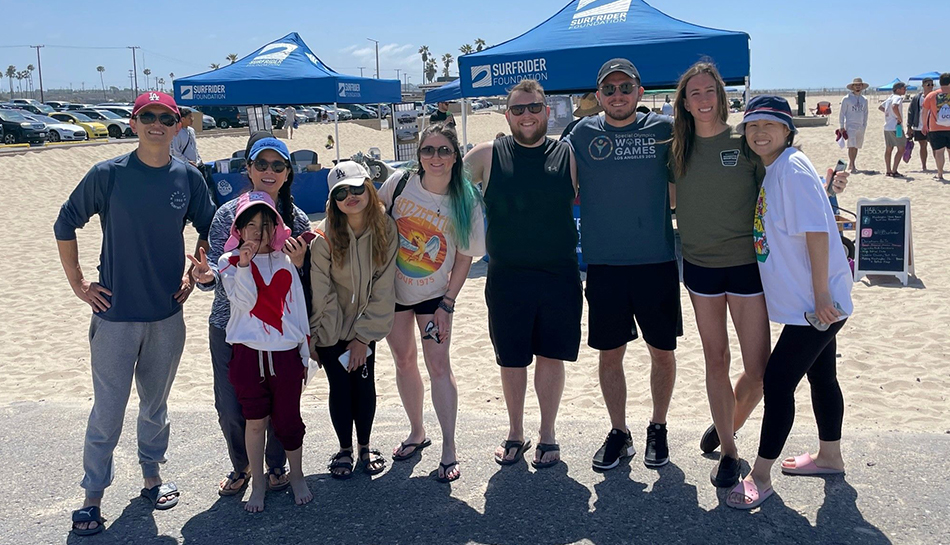 group of employees at beach volunteer event
