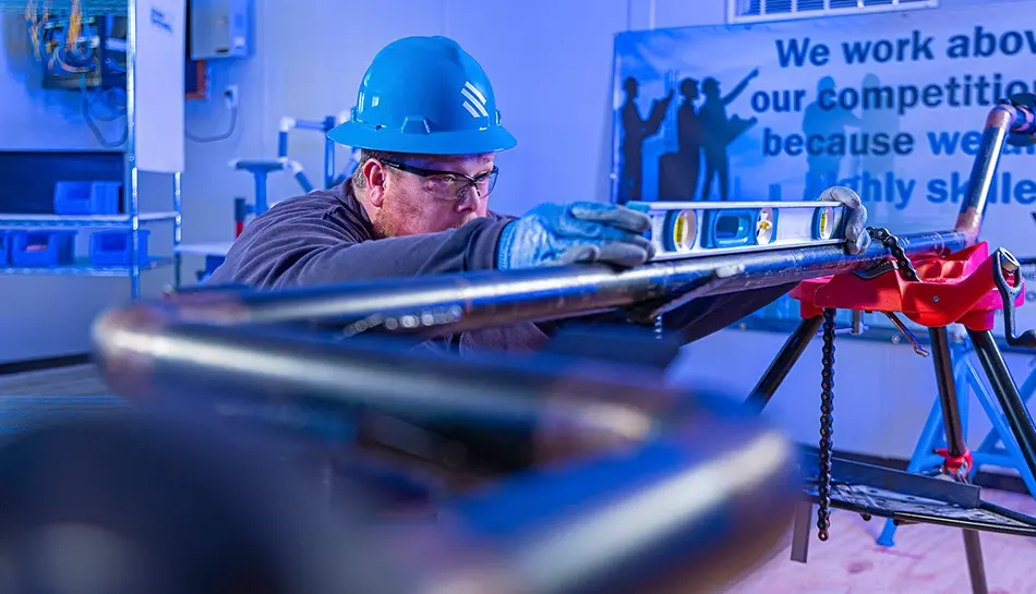 worker training with piping and level