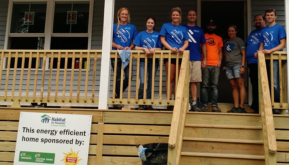 Habitat for Humanity volunteers on porch of house being built