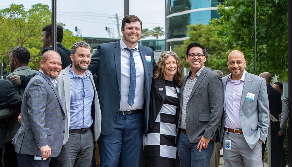 group of employees pause for celebration