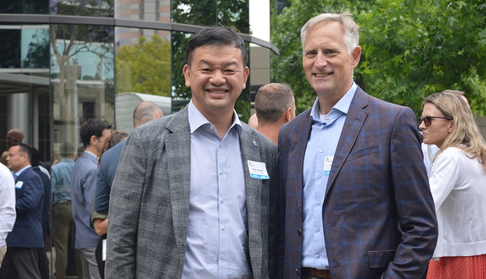 Two employees posing together