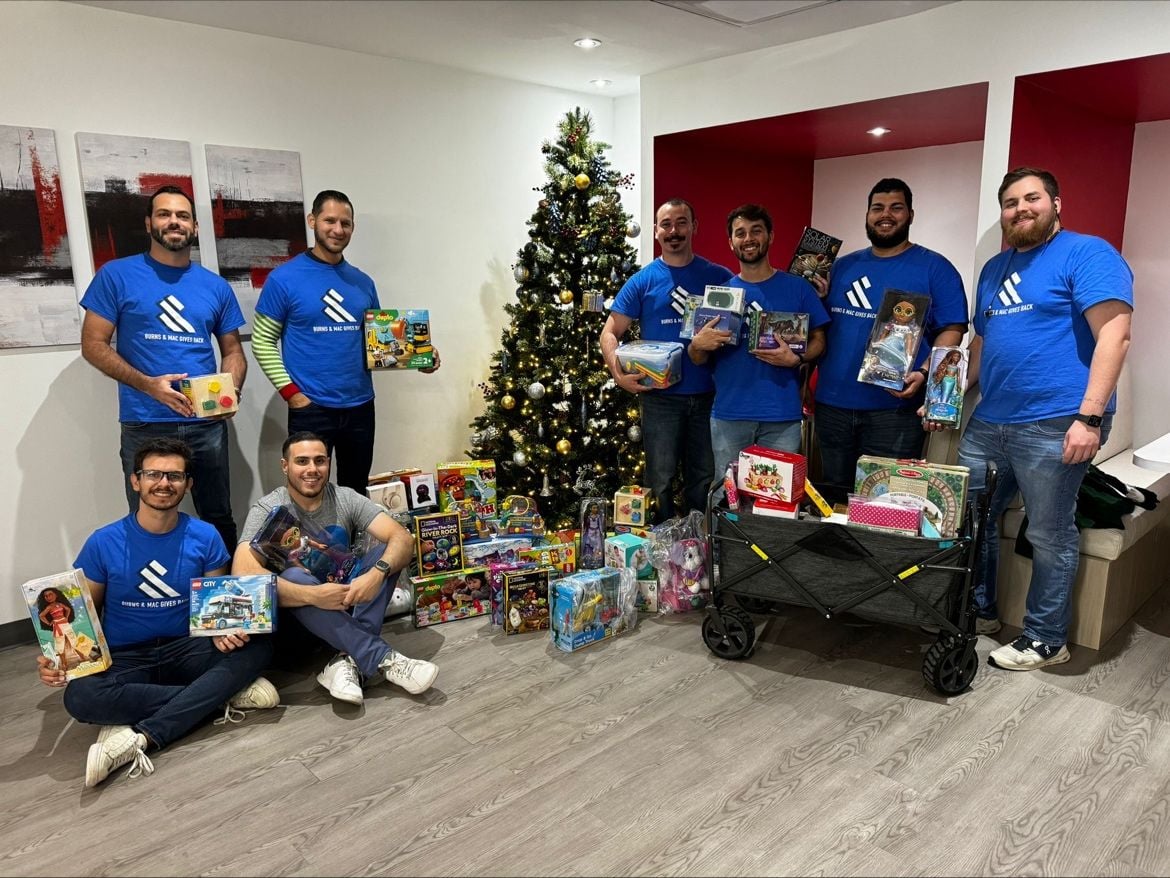Team members with holiday donations