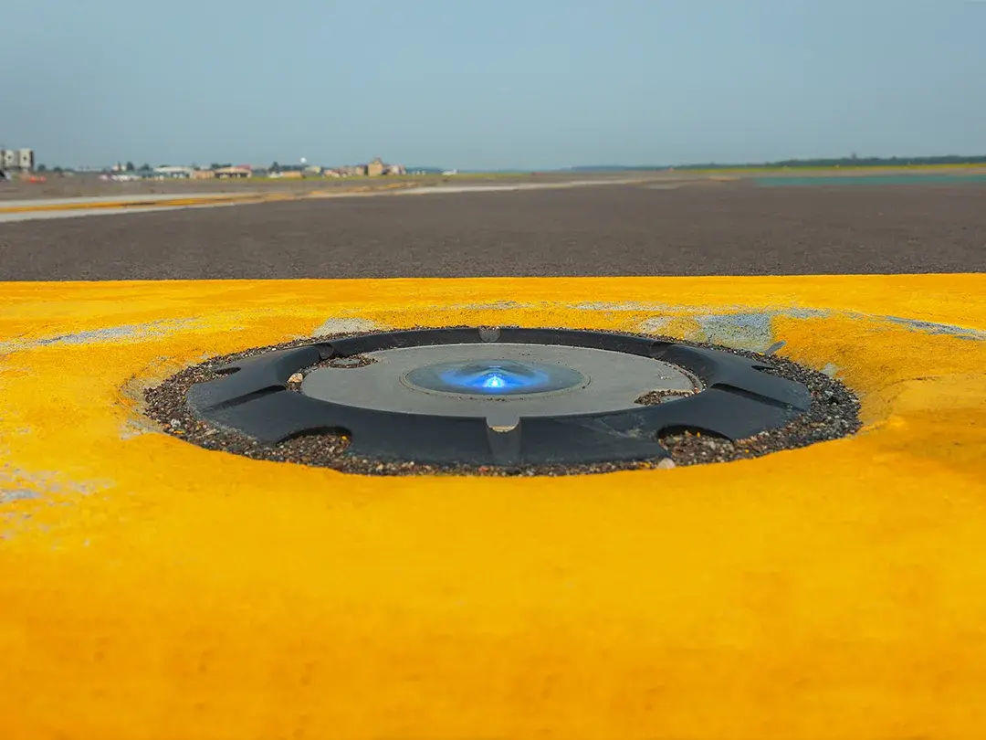 closeup of in-pavement lighting on a runway or taxiway
