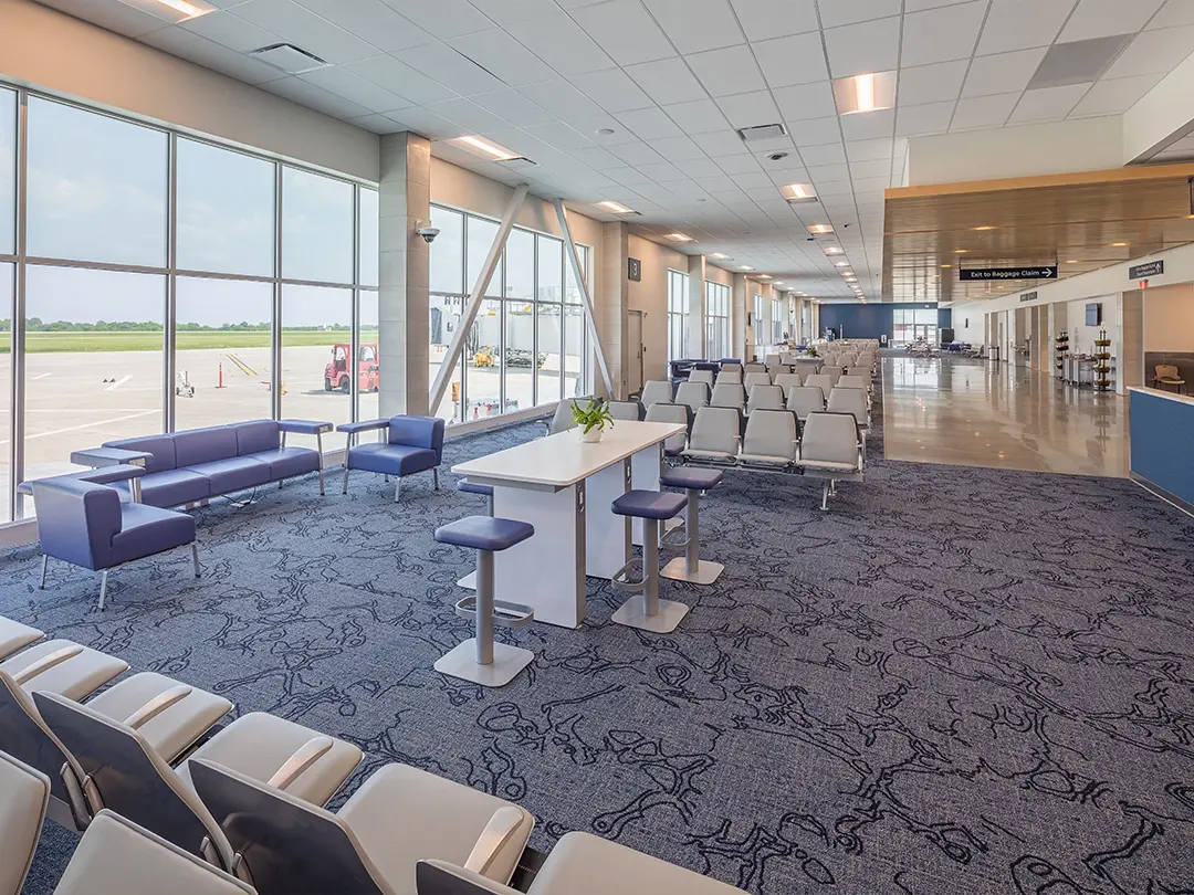 airside gate with row seating, work table and couch seating area 