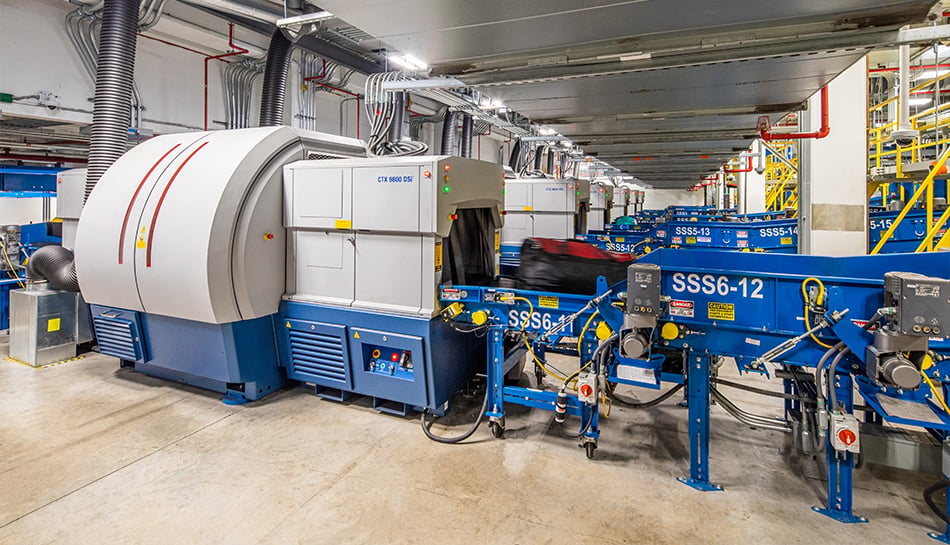 baggage moves through scanning and sorting equipment