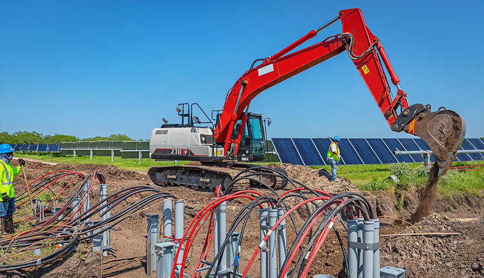 excavator digging on solar project site