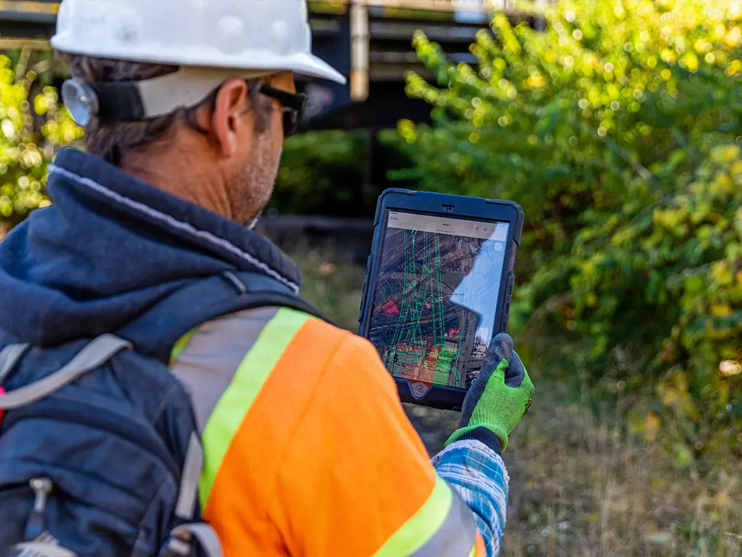 worker uses table to track location of items on project site