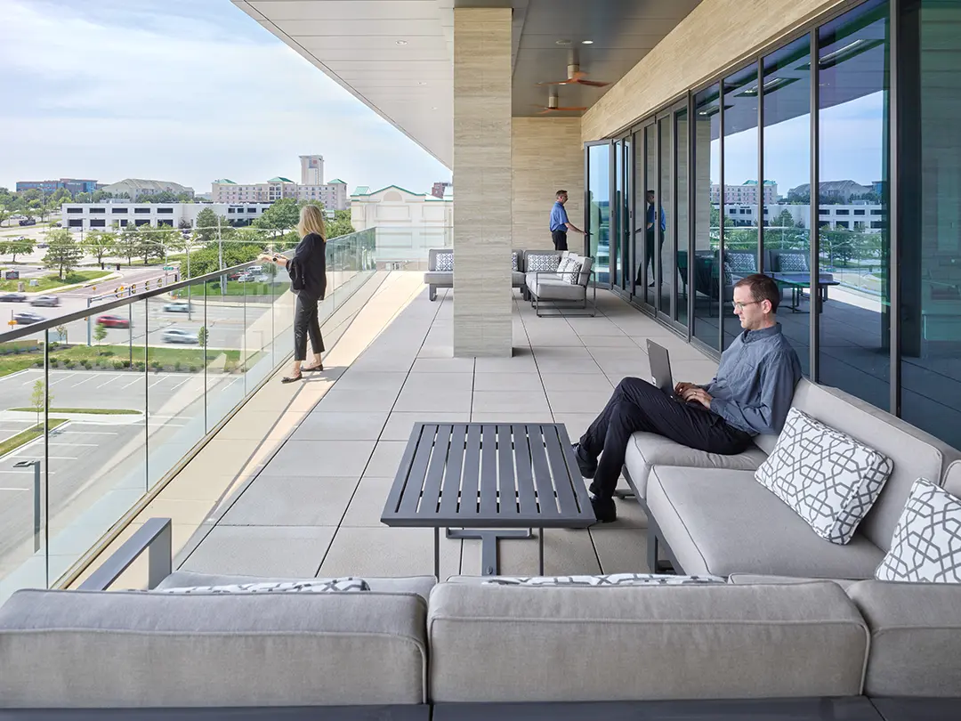 office workers on building balcony area
