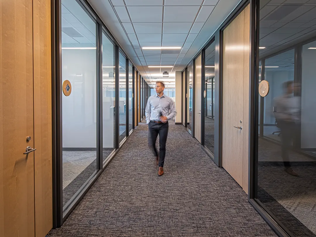 office worker walking in hallway