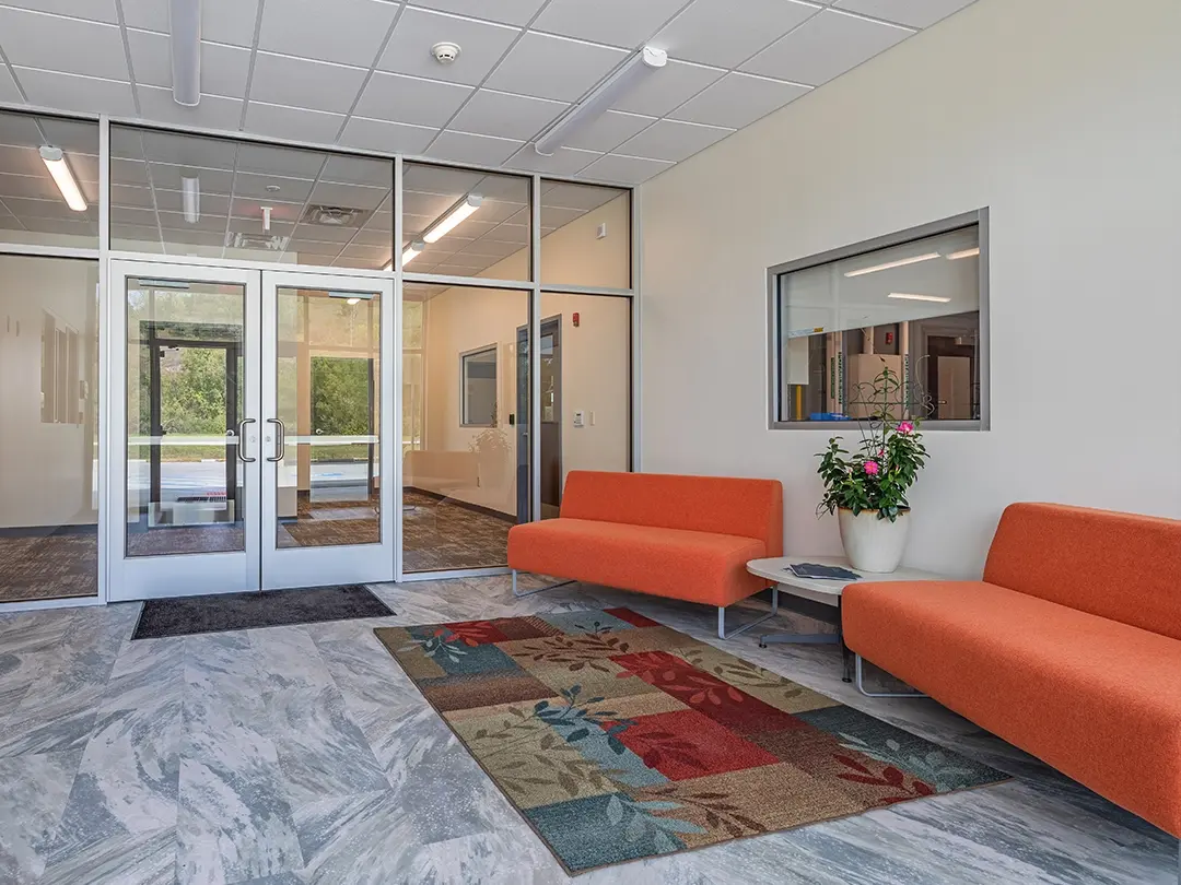 lobby entrance with orange couches