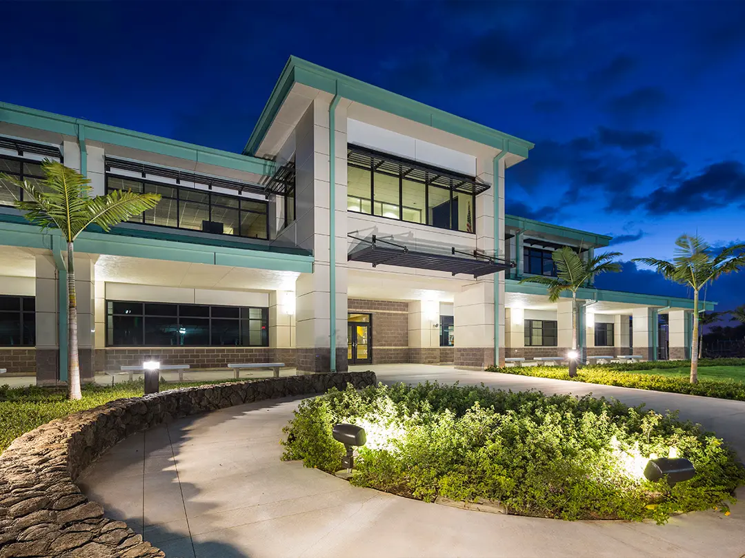 exterior view of facility entrance at night