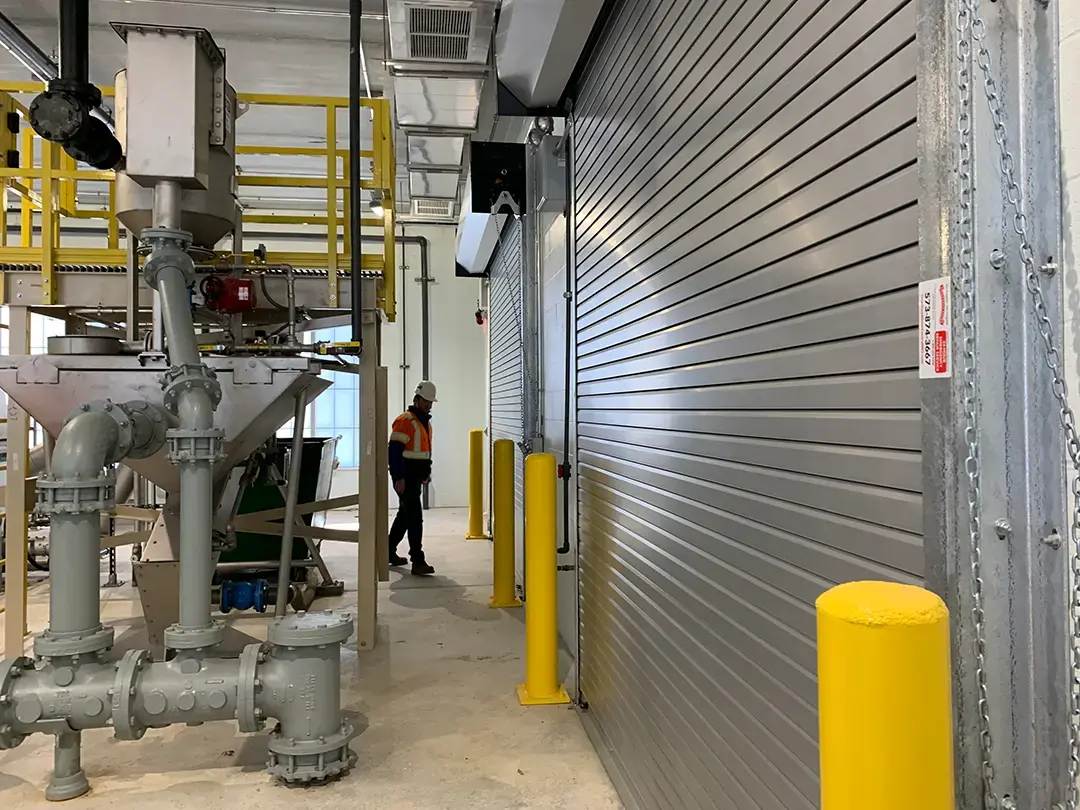 worker among interior equipment