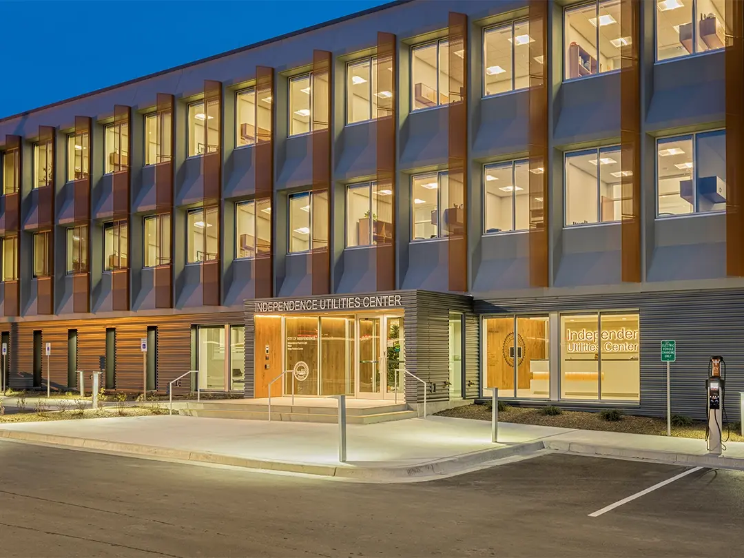 exterior of building entrance at dusk, with lighting