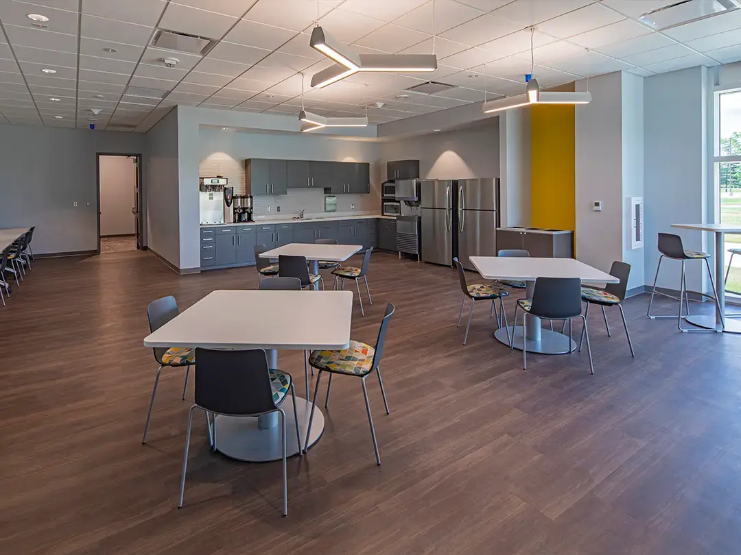 break room with kitchen and dining areas