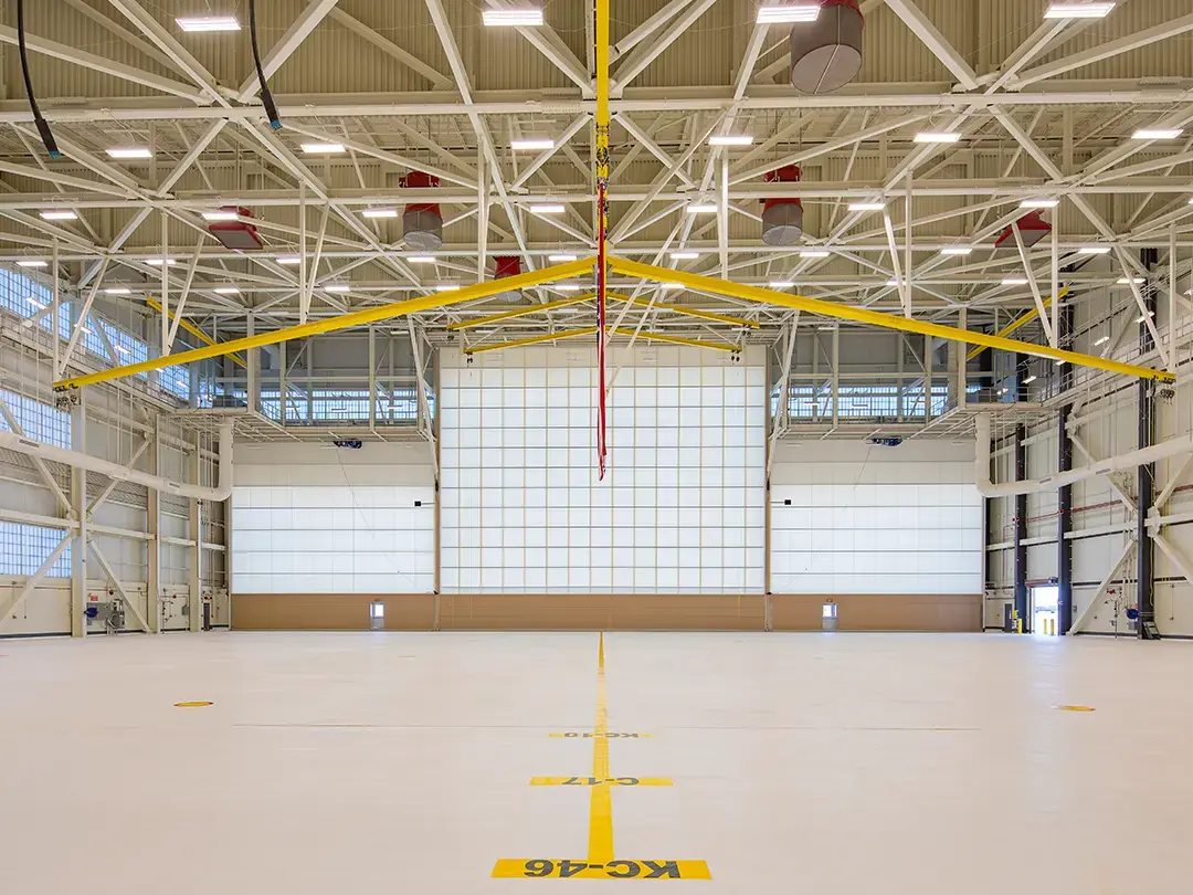 interior view of hangar space, looking toward closed bay doors