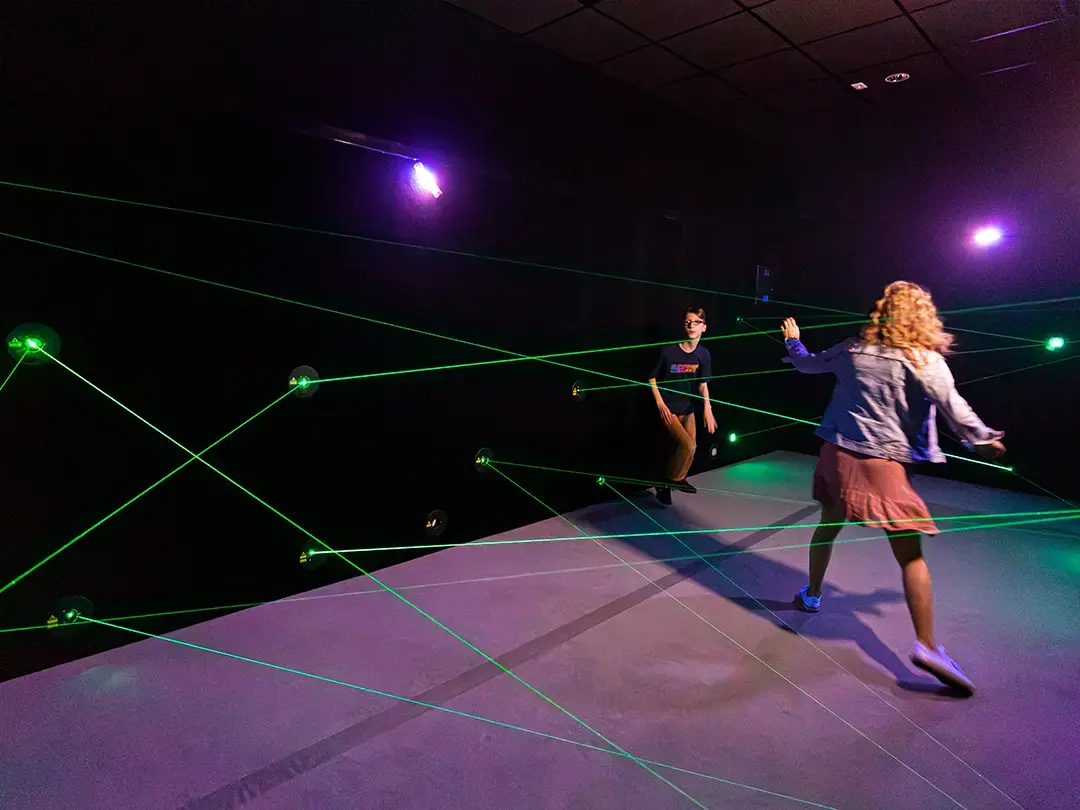 students play in the laser exhibit