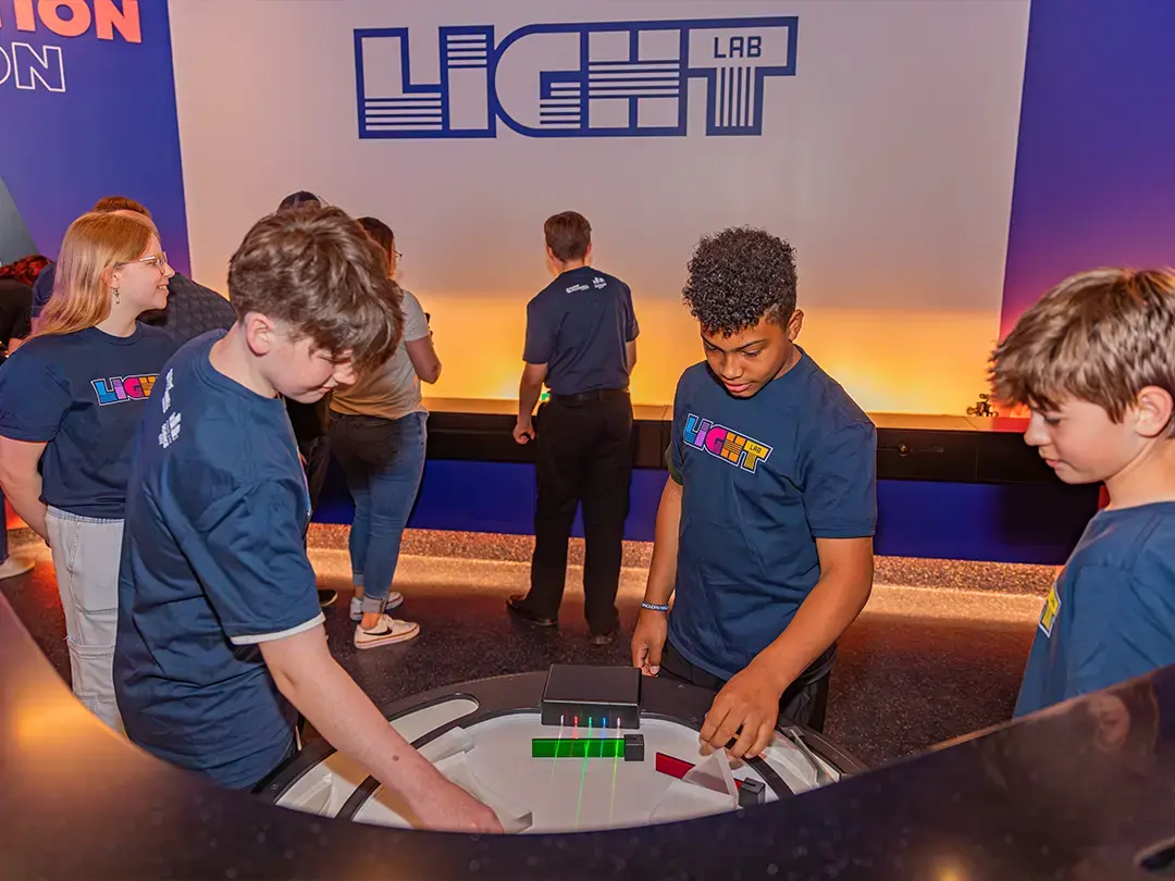 students try out light filter table