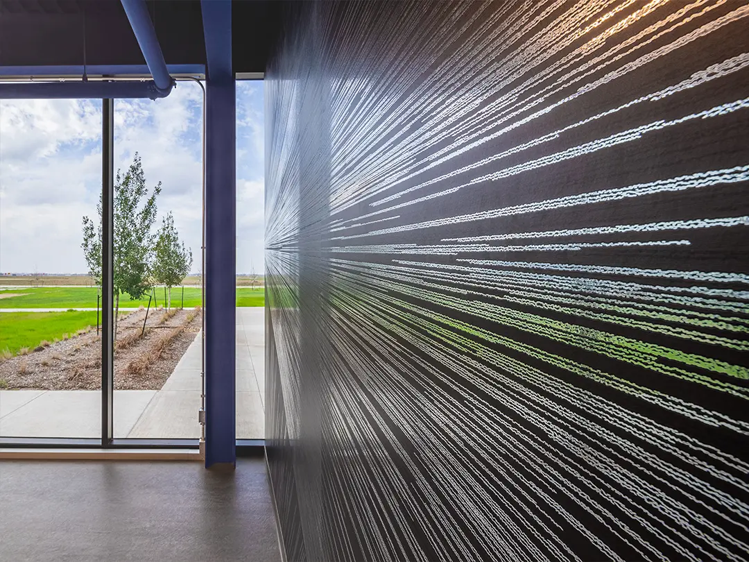 glass exit door and dramatic wall treatment that evokes space travel
