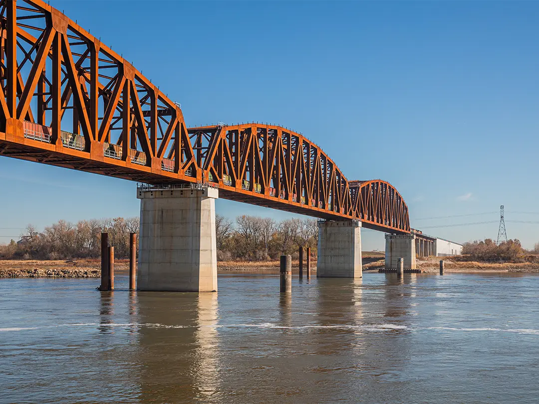 bridge spans in place over river