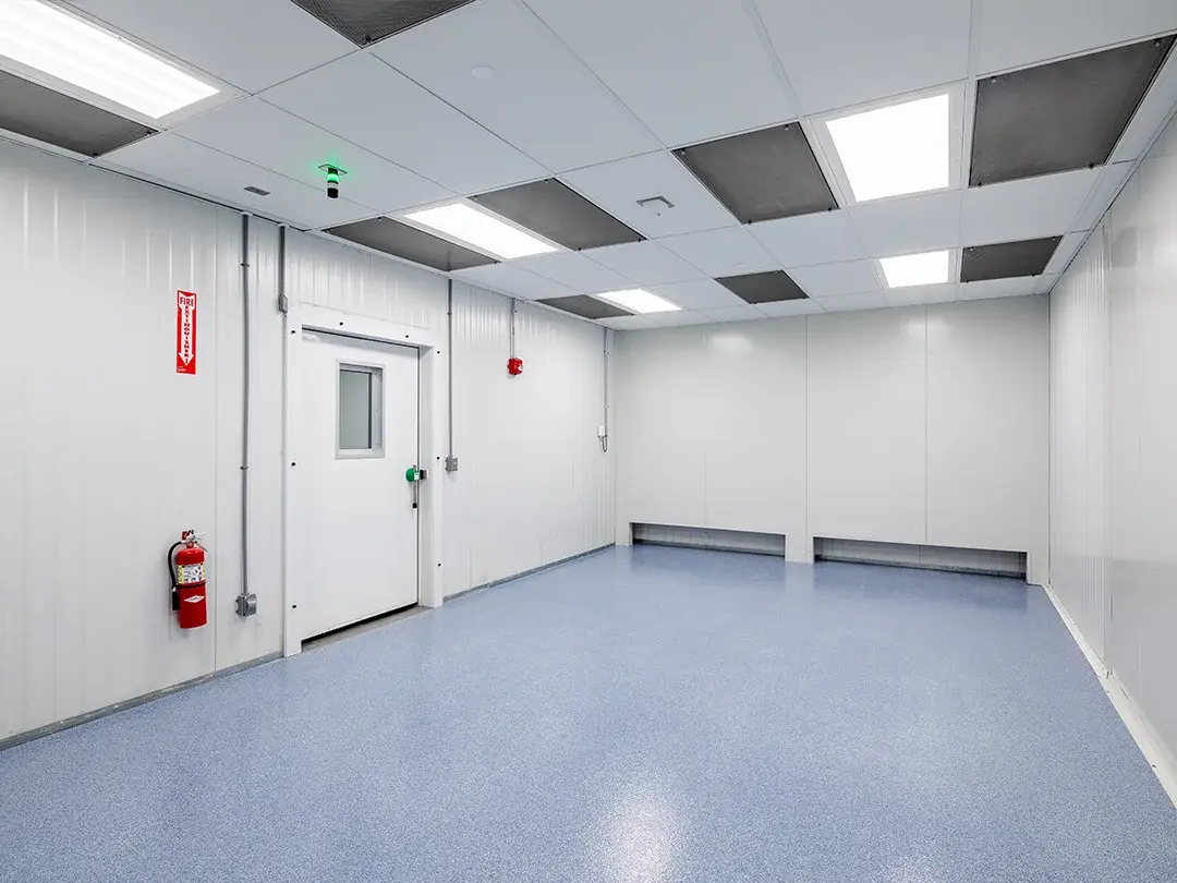 empty room with blue floor, door and fire extinguisher 