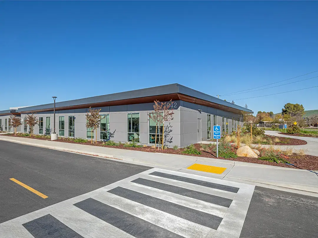 building exterior view from street with crosswalk