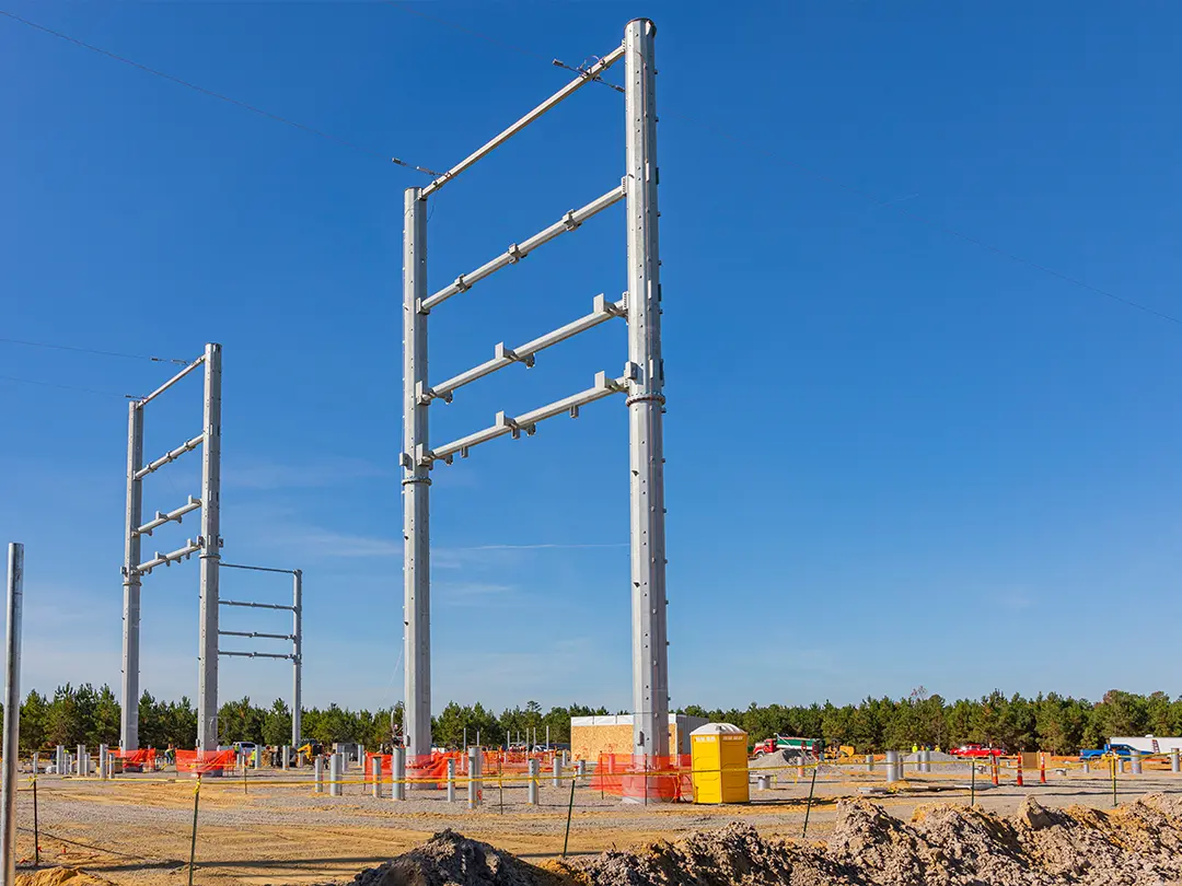 transmission line structures in place on substation construction site