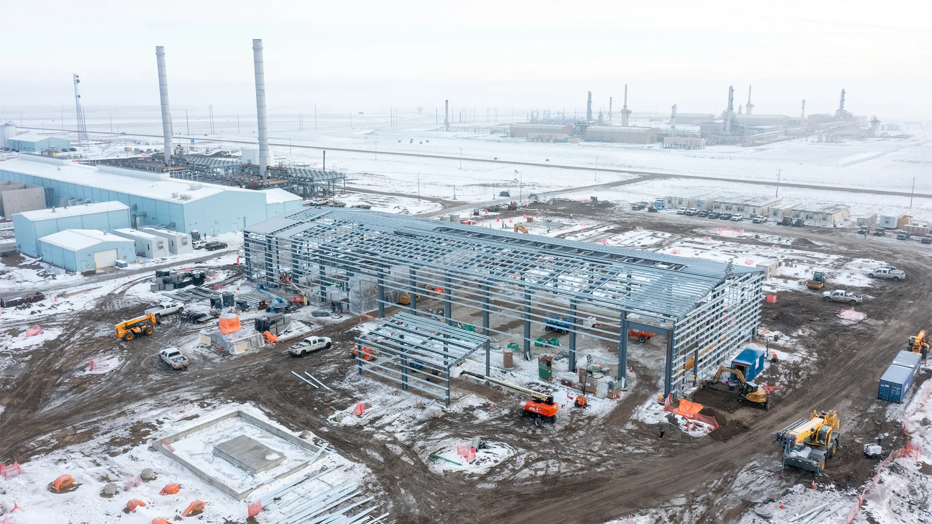 aerial view of power plant construction site in winter