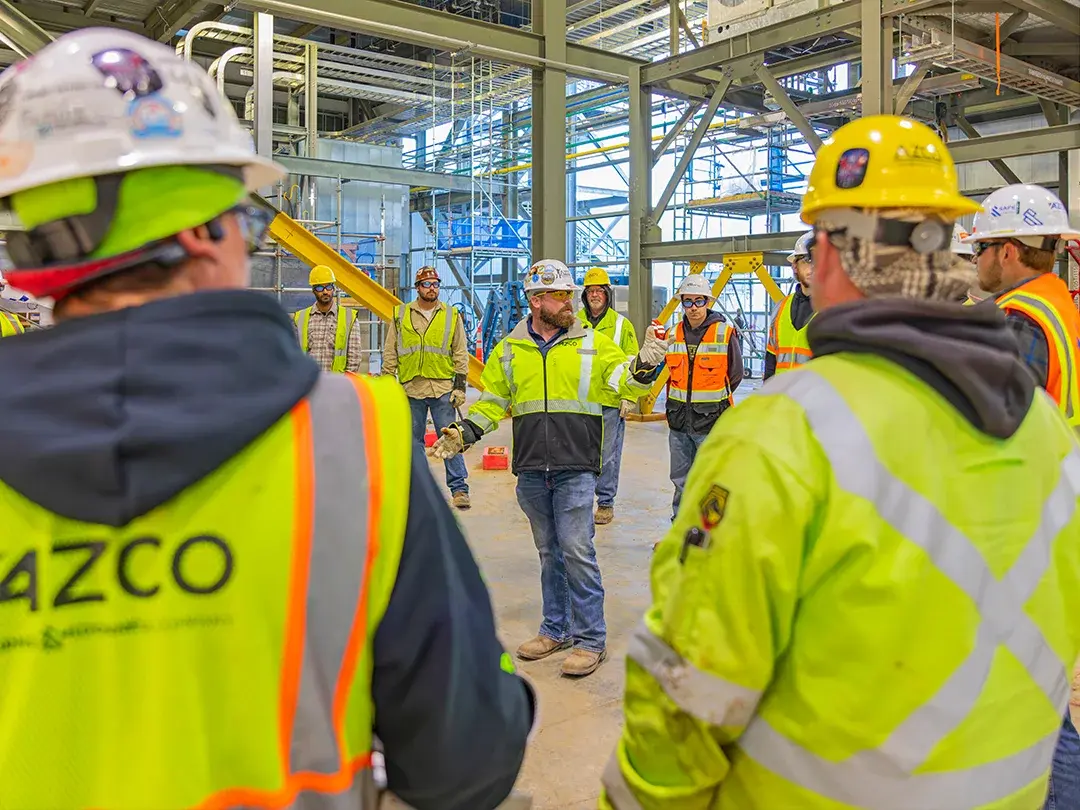 construction team meeting on jobsite