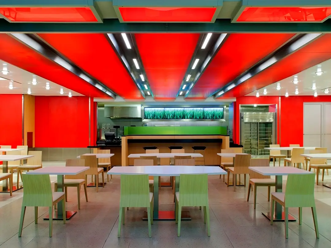 dining area with dramatic red ceiling lighting