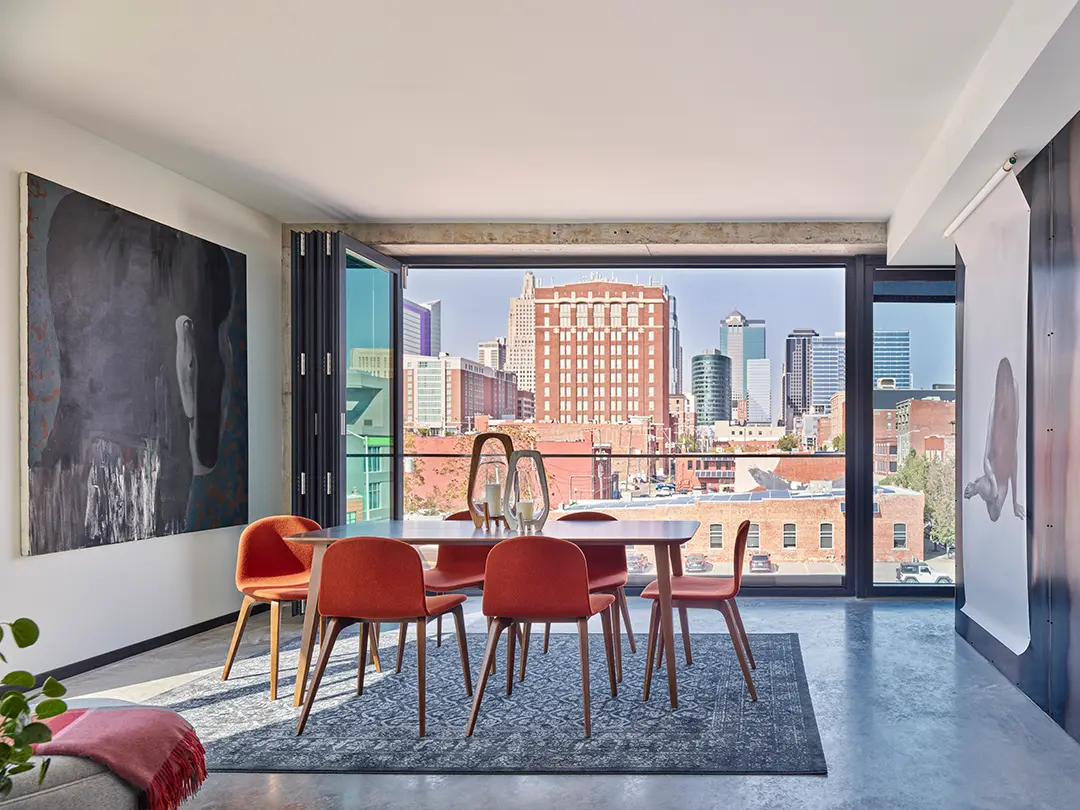 apartment dining space with window view of downtown