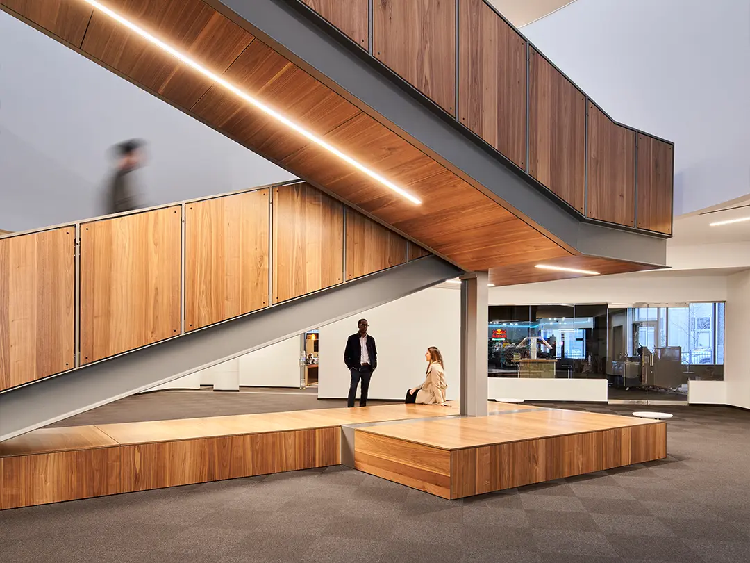 dramatic wood-clad staircase in building lobby