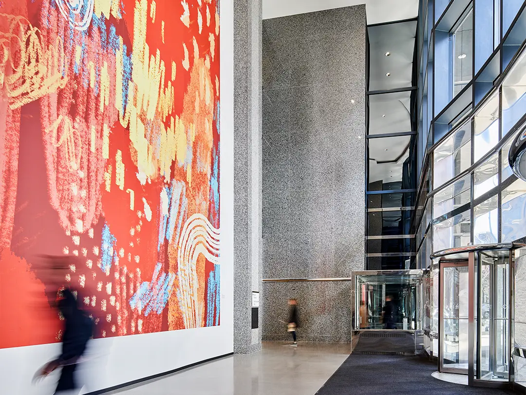 large colorful artwork near entrance in building lobby