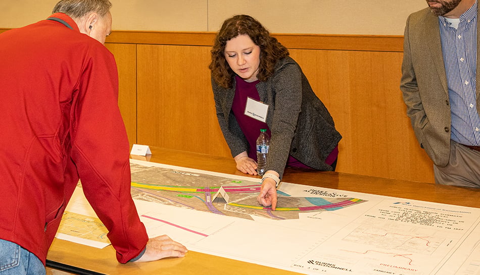 team member describes element on plan during a public meeting