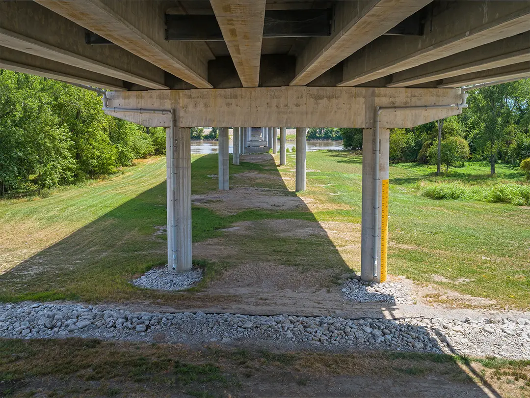 view of underside of bridge supports on land